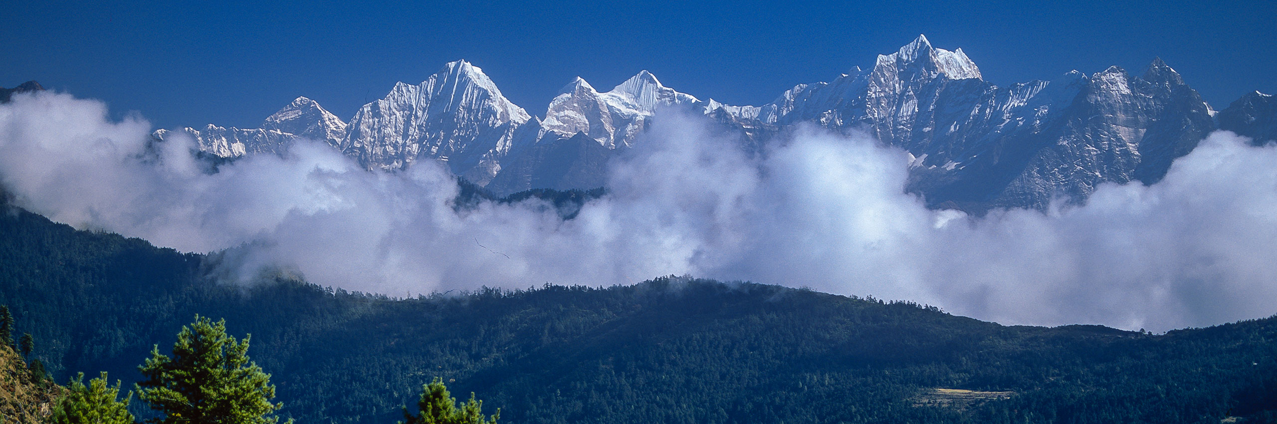 A distant view of Everest and peaks of The Khumbu Himalaya, Nepal, by Mountain Images photographer Ian Evans